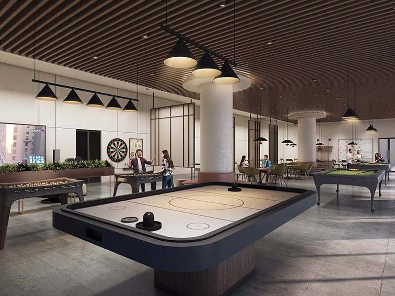 Indoor games room with air hockey and pool tables