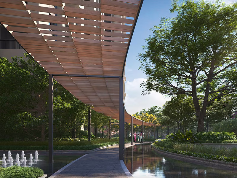 Shaded walkway alongside the podium water body