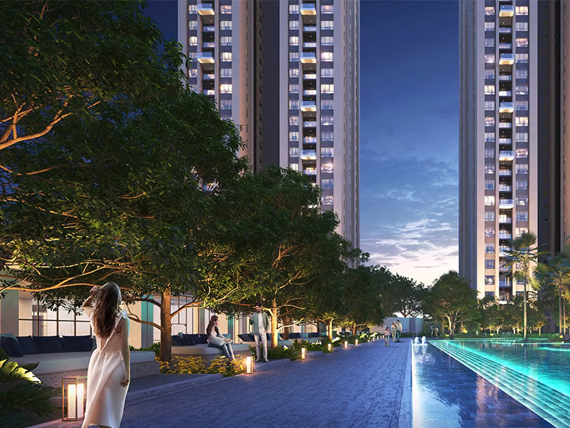 Tree-lined poolside promenade at dusk